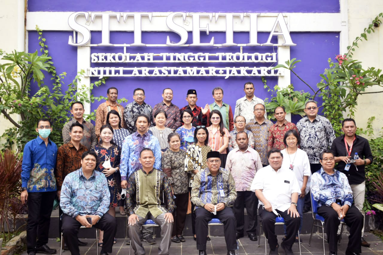 A group of people posing for a photo Description automatically generated