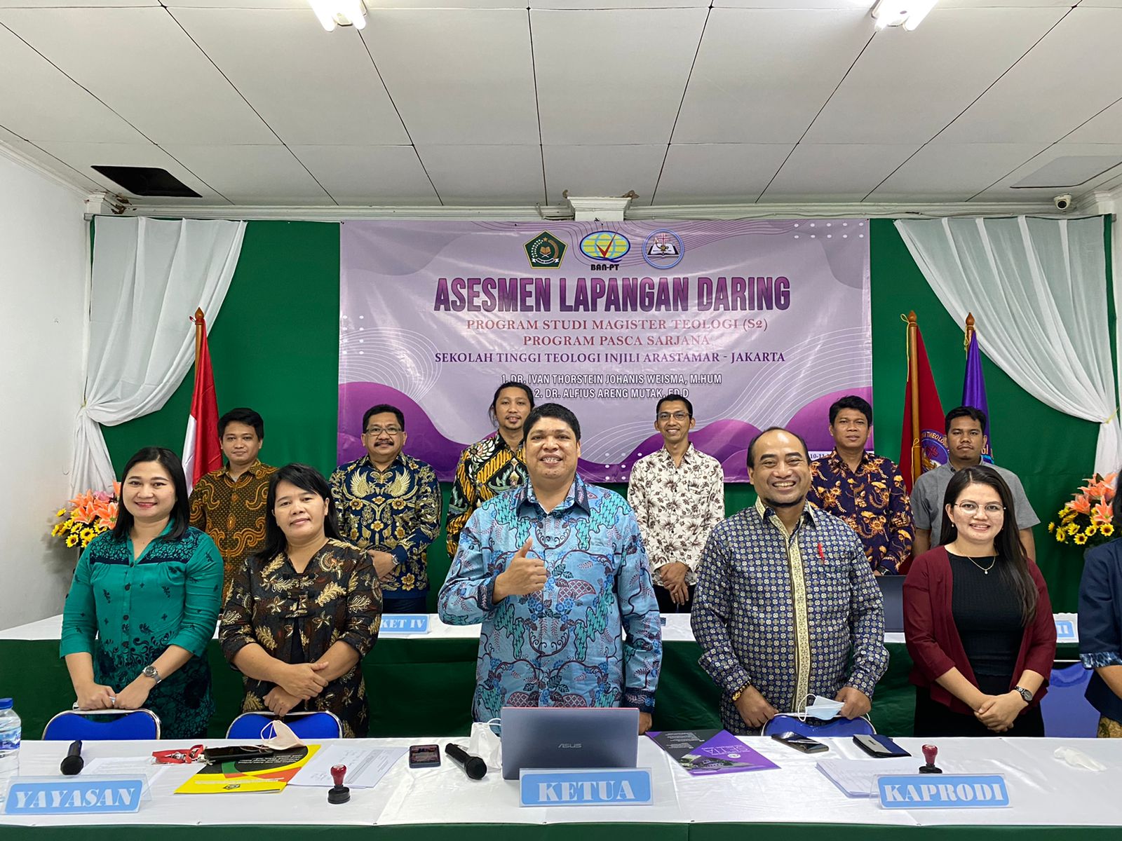 A group of people posing for a photo Description automatically generated